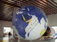 La tierra enorme durable hincha el globo, los globos llenados helio inflable fábrica 